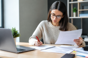 Professional writer revising an assignment after receiving academic writing feedback in the UK
