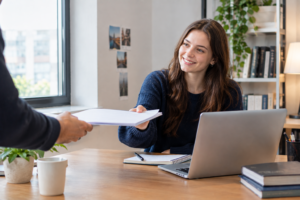 Student receiving an assignment on time through a deadline guarantee academic writing support process in the UK.